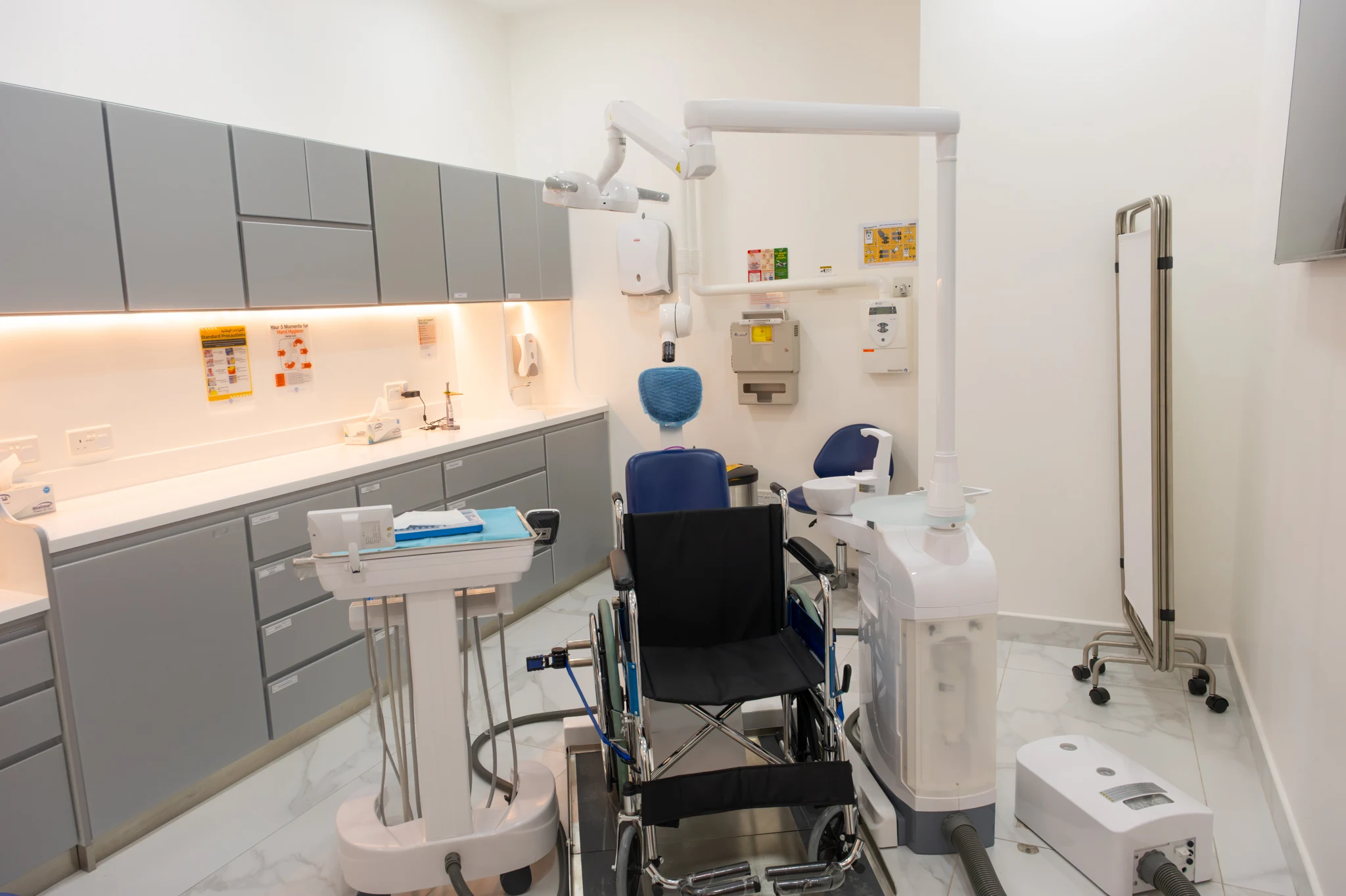Wide angled view of the accessible treatment room and dental equipment at Al Raha Mall