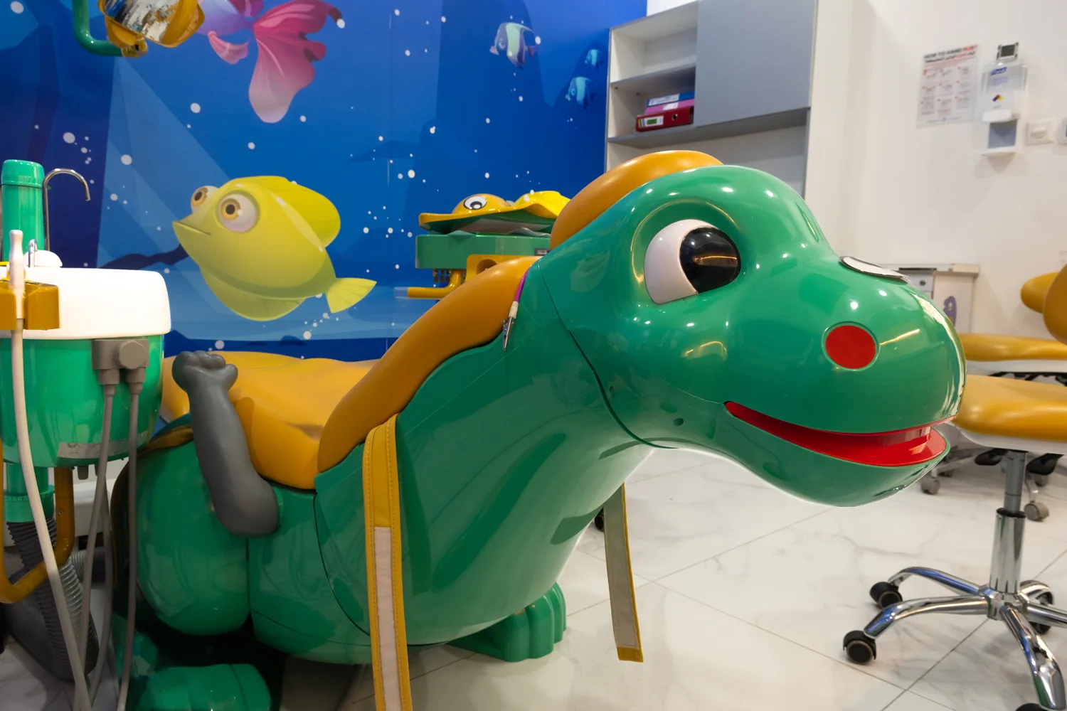 Child-focused dinosaur dental chair in the pediatric clinic